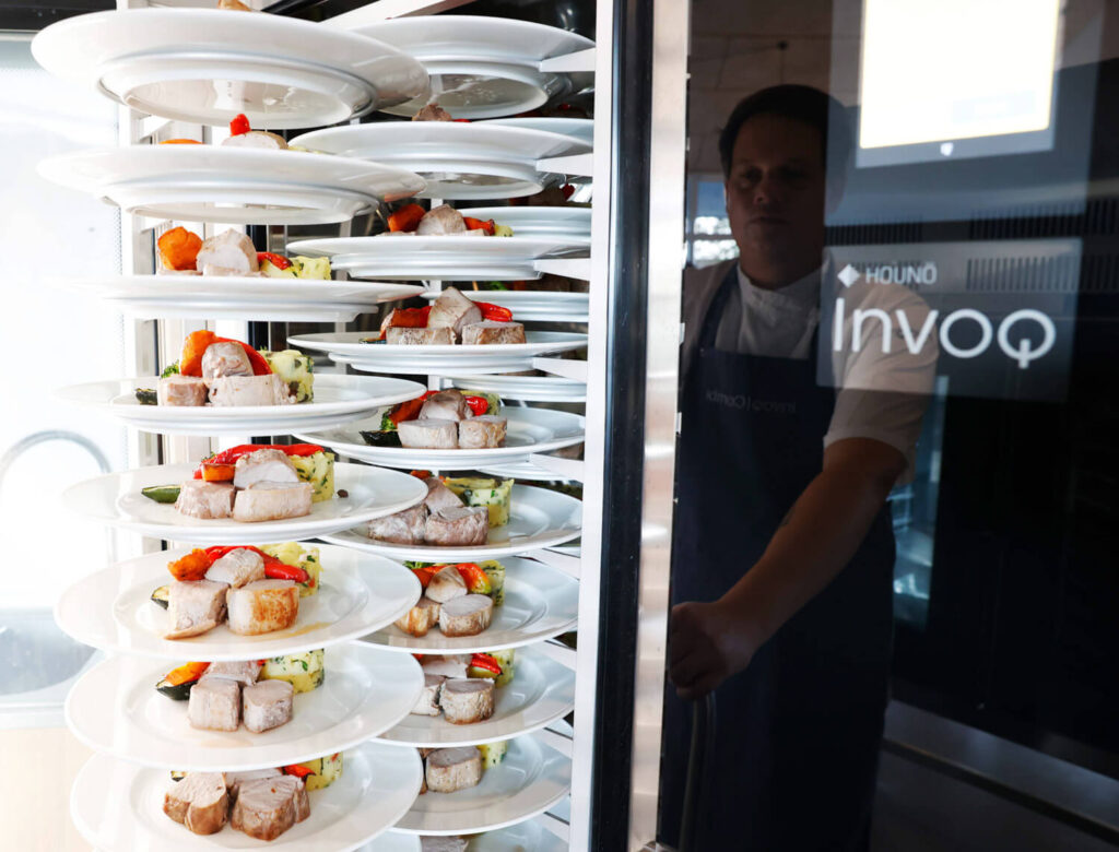 Meals plated and loaded on an Invoq banqueting trolley, prepared for regeneration in the oven for smooth and timely service